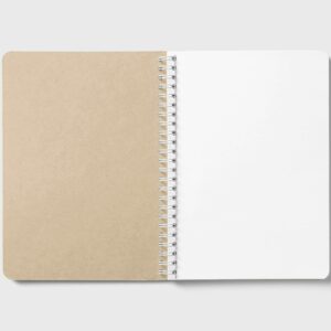 Dot-grid notebook open on desk